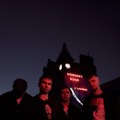 The four members of the band The Clockworks photographed in the dark