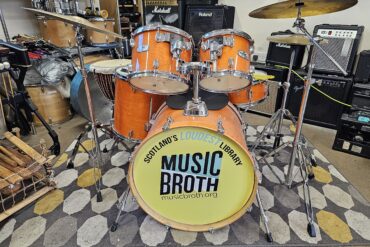 Drumkit with Music Broth on the front of the kit