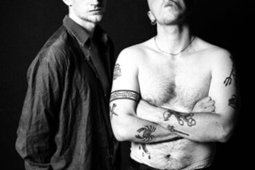 Black and white photo of Scottish music duo Doss