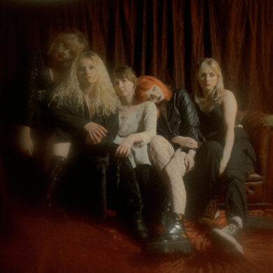 A colour photo of the band members of Venus Grrrls